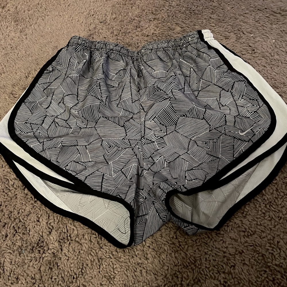 Womens size medium Nike dry fit athletic shorts in black and white.